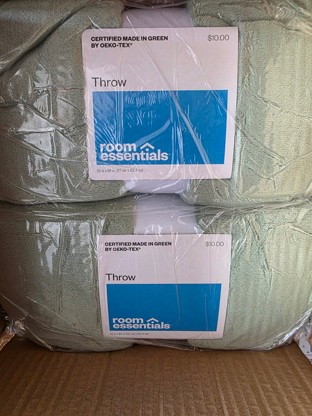 Room Essentials green plush throw, 50 by 60 inches; sold as a case of eight
